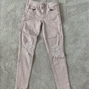 American Eagle pink ripped jeans